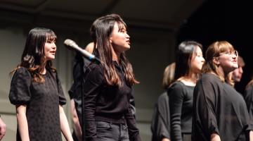 A group of vocalists performing in choir.